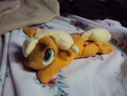 Size: 640x480 | Tagged: safe, artist:azedo, applejack (mlp), earth pony, equine, fictional species, mammal, pony, feral, friendship is magic, hasbro, my little pony, 2013, beanie, blanket, female, irl, lying down, photo, photographed artwork, plushie, prone, solo, solo female, tail