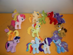 Size: 4608x3456 | Tagged: safe, artist:bastler, artist:moon flower, furbooru exclusive, applejack (mlp), fluttershy (mlp), pinkie pie (mlp), rainbow dash (mlp), rarity (mlp), time turner (mlp), trixie (mlp), twilight sparkle (mlp), oc, oc:comment, oc:downvote, oc:favourite, oc:upvote, oc:viva reverie, alicorn, earth pony, equine, fictional species, mammal, pegasus, pony, unicorn, feral, series:derpibooru's my little pony:friendship is magic 10th anniversary event by moon flower, friendship is magic, hasbro, my little pony, 10, 2020, 4th dimension entertainment, apple, arrow, art event, balloon, baseball cap, bed, blue eyes, blue hair, bow, bracelet, brown body, brown fur, brown hair, cap, cape, clothes, collar, cowboy hat, cutie mark, derpibooru, derpibooru's my little pony: friendship is magic 10th anniversary art event, diamond, feathered wings, feathers, female, floppy ears, folded wings, food, fruit, fur, gem, green body, green eyes, green fur, green hair, group photo, hair, hair bow, hairpin, hat, high res, hooves, horn, hourglass, indoors, irl, jewelry, lidded eyes, logo, looking at each other, looking away, lying down, lying on bed, male, mane, mare, mattress, meta, necktie, on side, orange body, orange fur, orange hair, photo, photographed artwork, pink body, pink eyes, pink fur, pink hair, plushie, ponified, purple body, purple eyes, purple fur, purple hair, rainbow, rainbow hair, red body, red eyes, red fur, red hair, side view, smiling, speech bubble, spread wings, stallion, standing, star, tail, wall of tags, white hair, wings, wizard hat, yellow body, yellow fur, yellow hair