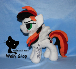 Size: 1104x1000 | Tagged: safe, artist:wollyshop, oc, oc only, oc:vegeto uchiha portgas, equine, fictional species, mammal, pegasus, pony, feral, friendship is magic, hasbro, my little pony, feathered wings, feathers, freckles, irl, looking at something, male, photo, photographed artwork, plushie, side view, solo, solo male, stallion, standing, tail, tattoo, wings
