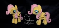 Size: 2124x1000 | Tagged: safe, artist:wollyshop, fluttershy (mlp), equine, fictional species, mammal, pegasus, pony, feral, friendship is magic, hasbro, my little pony, 2012, feathered wings, feathers, female, filly, foal, folded wings, hair, irl, mane, photo, photographed artwork, pink hair, pink mane, plushie, smiling, solo, solo female, tail, watermark, wings, young, younger
