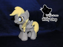 Size: 600x449 | Tagged: safe, artist:wollyshop, derpy hooves (mlp), equine, fictional species, mammal, pegasus, pony, feral, friendship is magic, hasbro, my little pony, 2013, feathered wings, feathers, female, filly, foal, folded wings, irl, photo, photographed artwork, plushie, smiling, solo, solo female, tail, watermark, wings, young, younger
