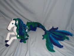 Size: 1024x768 | Tagged: safe, artist:fairywisheswishfairy, equine, fictional species, fish, hippocampus, mammal, feral, ambiguous gender, amigurumi, colored hooves, fins, fish tail, hair, hooves, irl, mane, photo, photographed artwork, plushie, solo, solo ambiguous, tail
