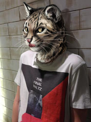 Size: 356x475 | Tagged: safe, artist:kenket, photographer:hashtagpurr, feline, geoffroy's cat, human, mammal, 2014, brown body, brown fur, clothes, digital art, draw over, front view, fur, irl, licking, licking lips, looking sideways, low res, male, photo, poodling, shirt, skin, solo, solo male, spotted fur, tan body, tan fur, three-quarter view, tongue, tongue out, topwear, whiskers