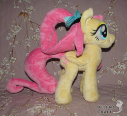 Size: 1024x939 | Tagged: safe, artist:allunacraft, artist:lilsy-workshop, fluttershy (mlp), equine, fictional species, mammal, pegasus, pony, feral, friendship is magic, hasbro, my little pony, 2021, feathered wings, feathers, female, folded wings, irl, mare, older, photo, photographed artwork, plushie, smiling, solo, solo female, tail, wings