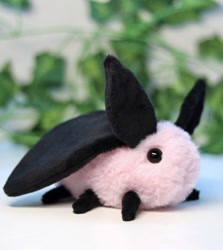 Size: 1170x1313 | Tagged: safe, artist:yourmomjpeg, part of a set, arthropod, insect, moth, feral, 2021, black body, black eyes, dot eyes, ears, irl, photo, photographed artwork, pink body, plushie, six legs, wings